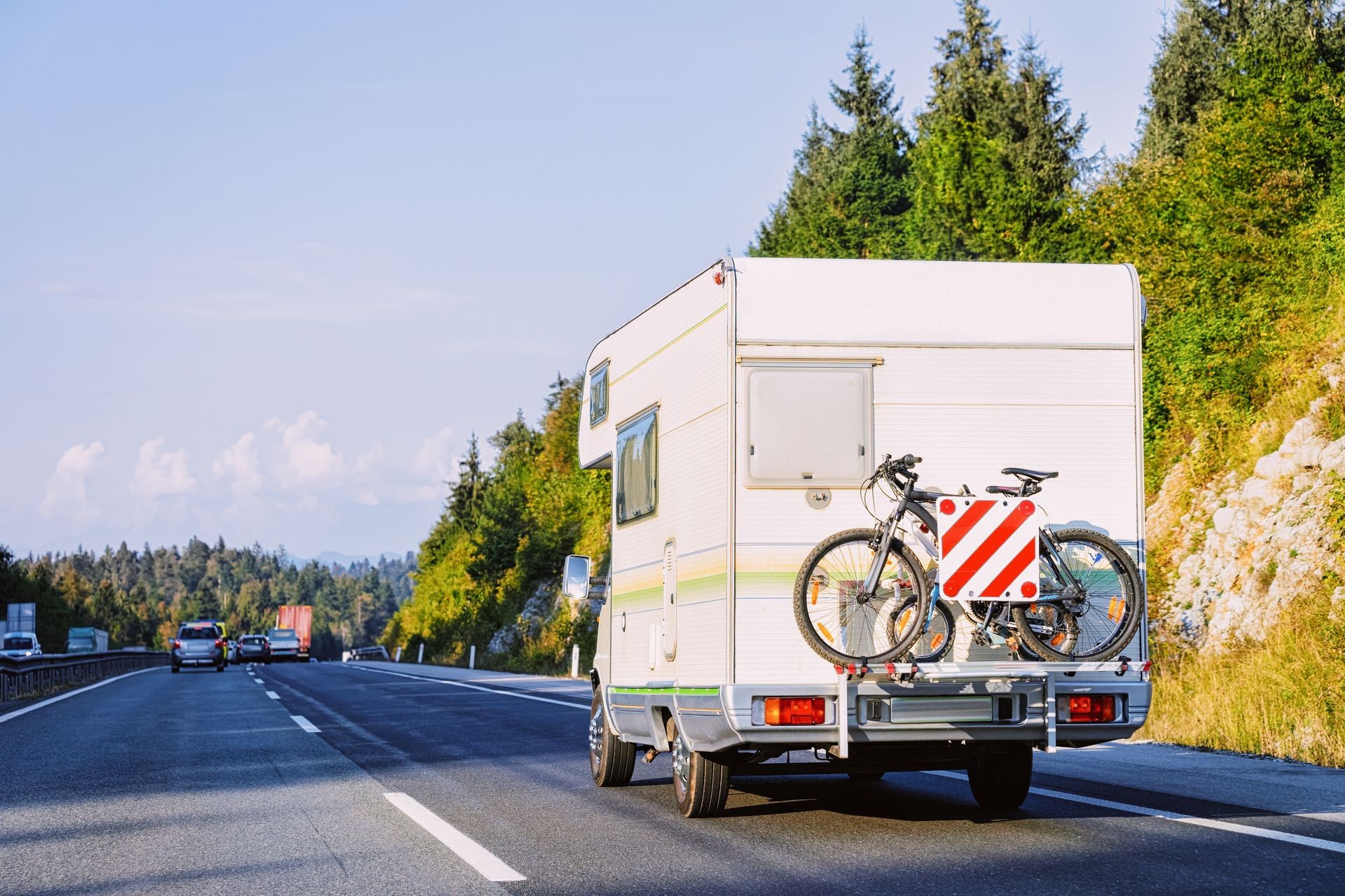 Camper rv abd bicycle on the road in Slovenia.